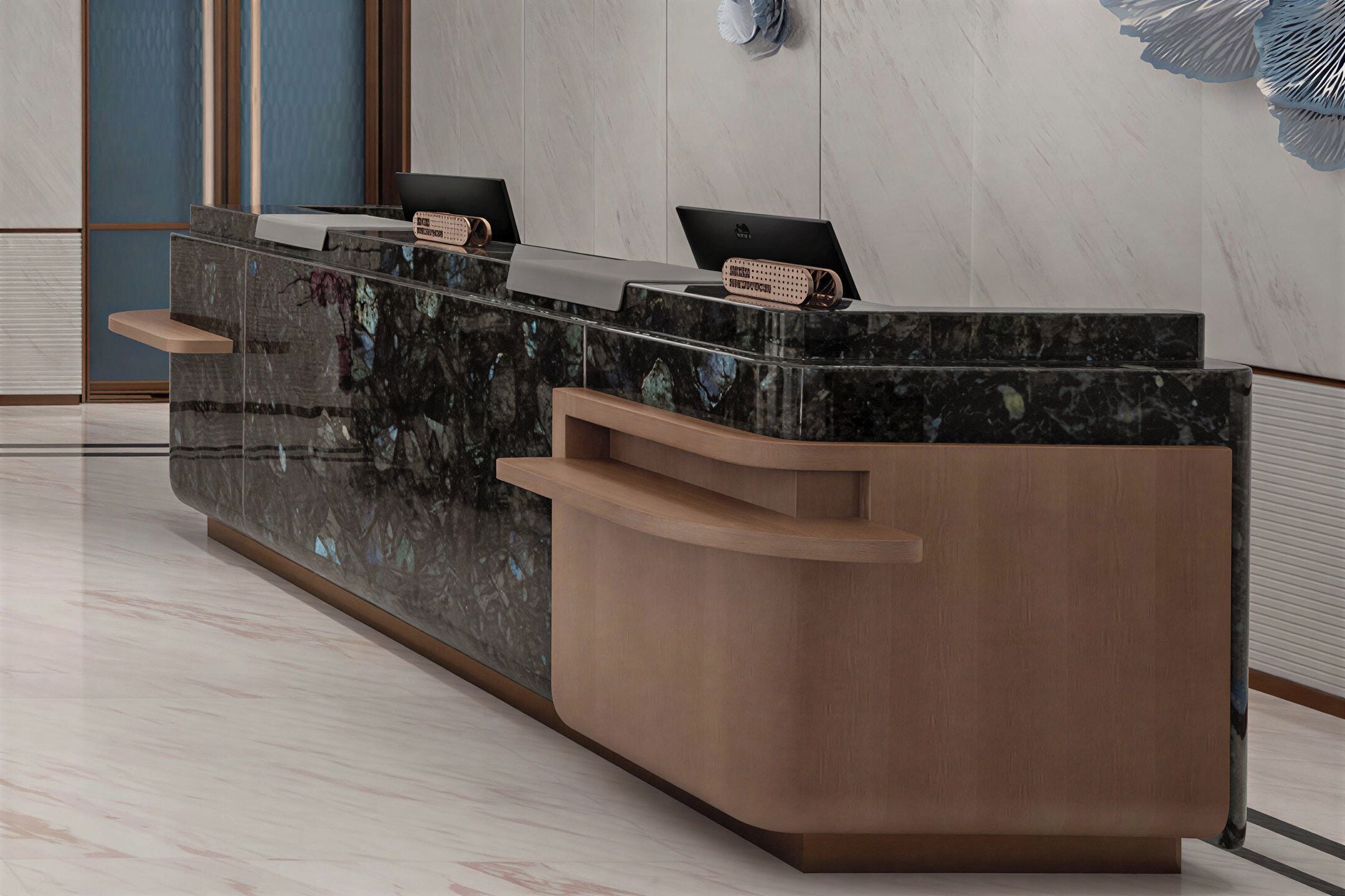 A reception desk with a marble top and wooden base, equipped with two laptops and a decorative item.