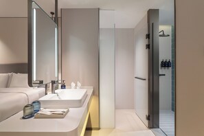Shower, designer toiletries, hair dryer, slippers