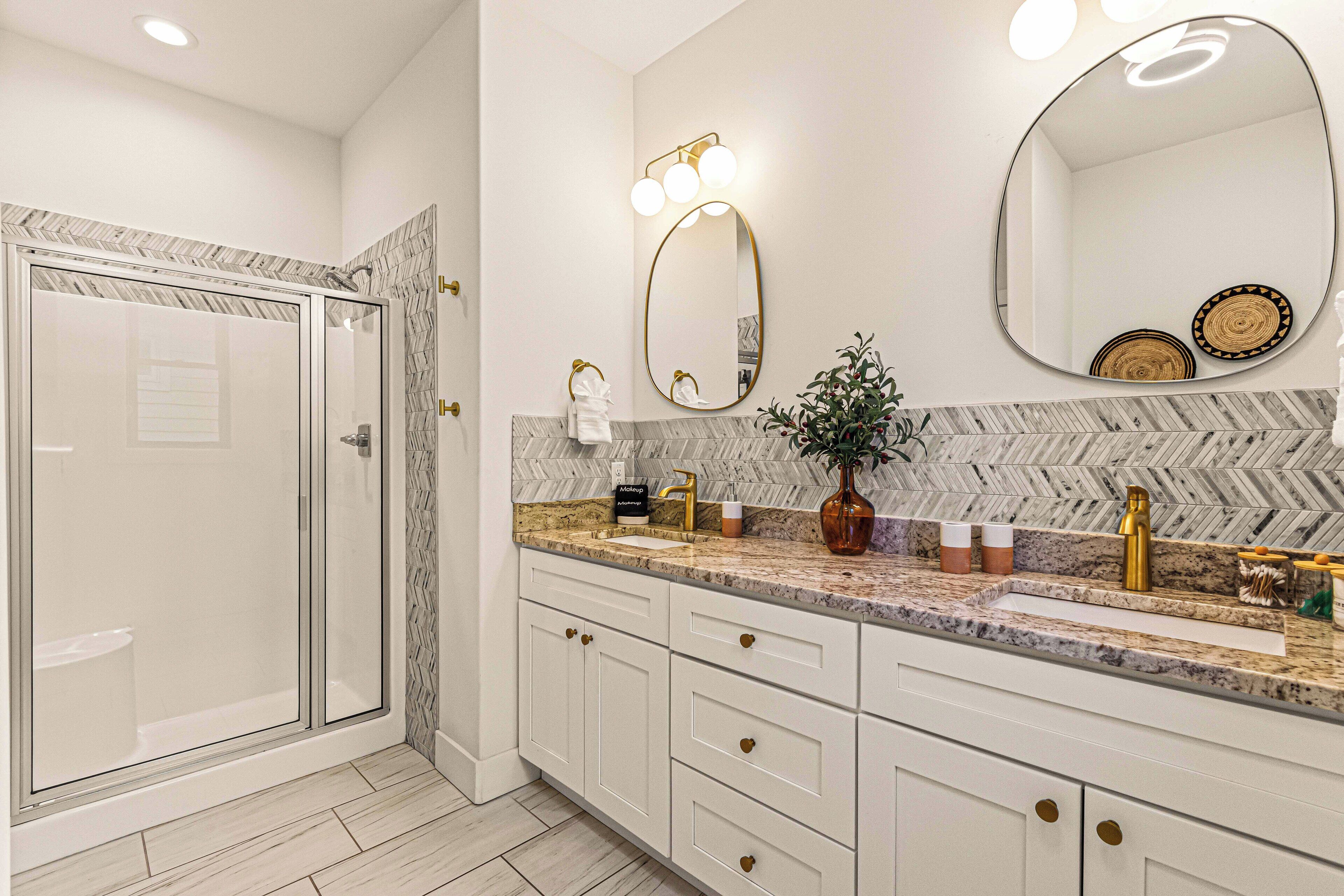 A modern master ensuite with clean lines and calming tone!