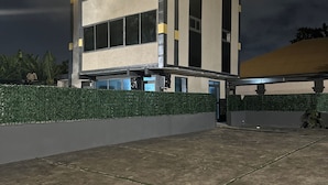 A modern building with a flat roof, large windows, and a well-lit facade. - Northwold Hotel-Pokuase Interchange ACC (Kwabenya)