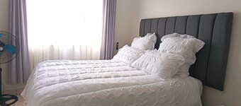 Beautiful apartment with AC in vibrant Durban in secured complex with pool.