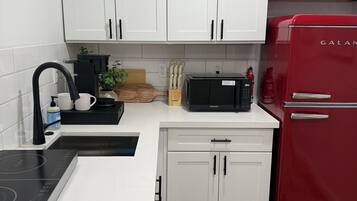 Fridge, microwave, stovetop, coffee/tea maker