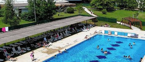 Seasonal outdoor pool, pool umbrellas, pool loungers