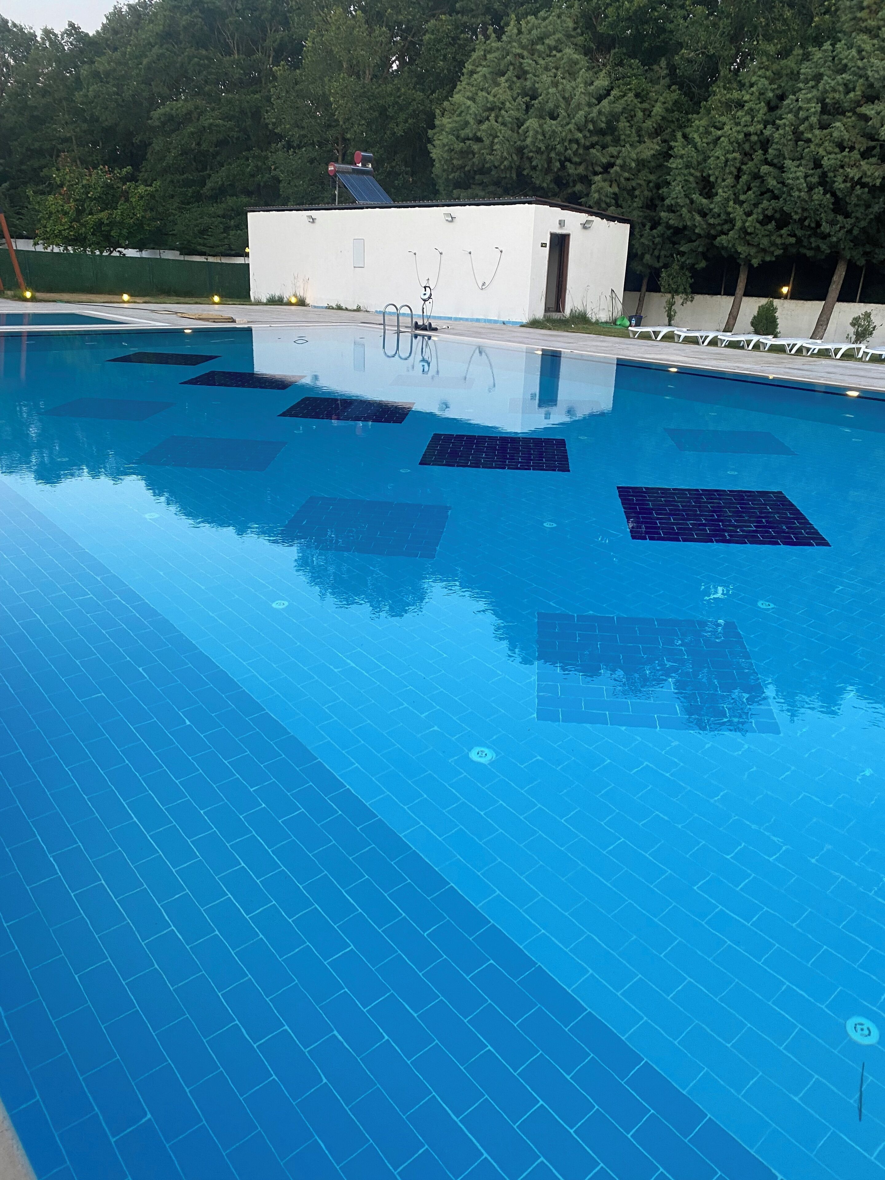 Seasonal outdoor pool, pool umbrellas, pool loungers