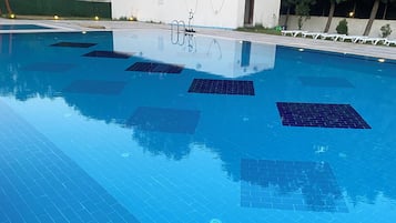 Seasonal outdoor pool, pool umbrellas, pool loungers