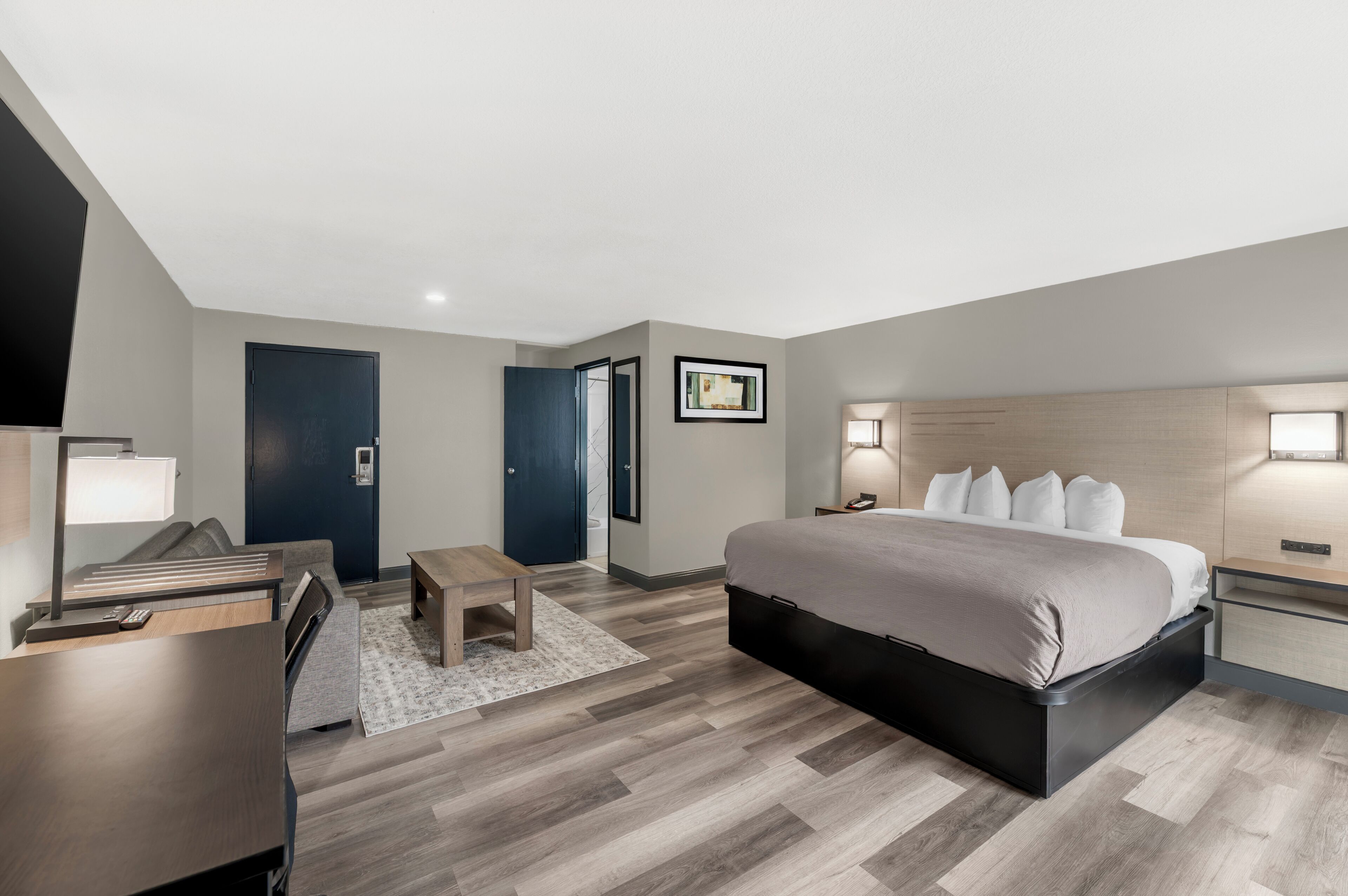 Studio Suite | Premium bedding, desk, laptop workspace, blackout drapes