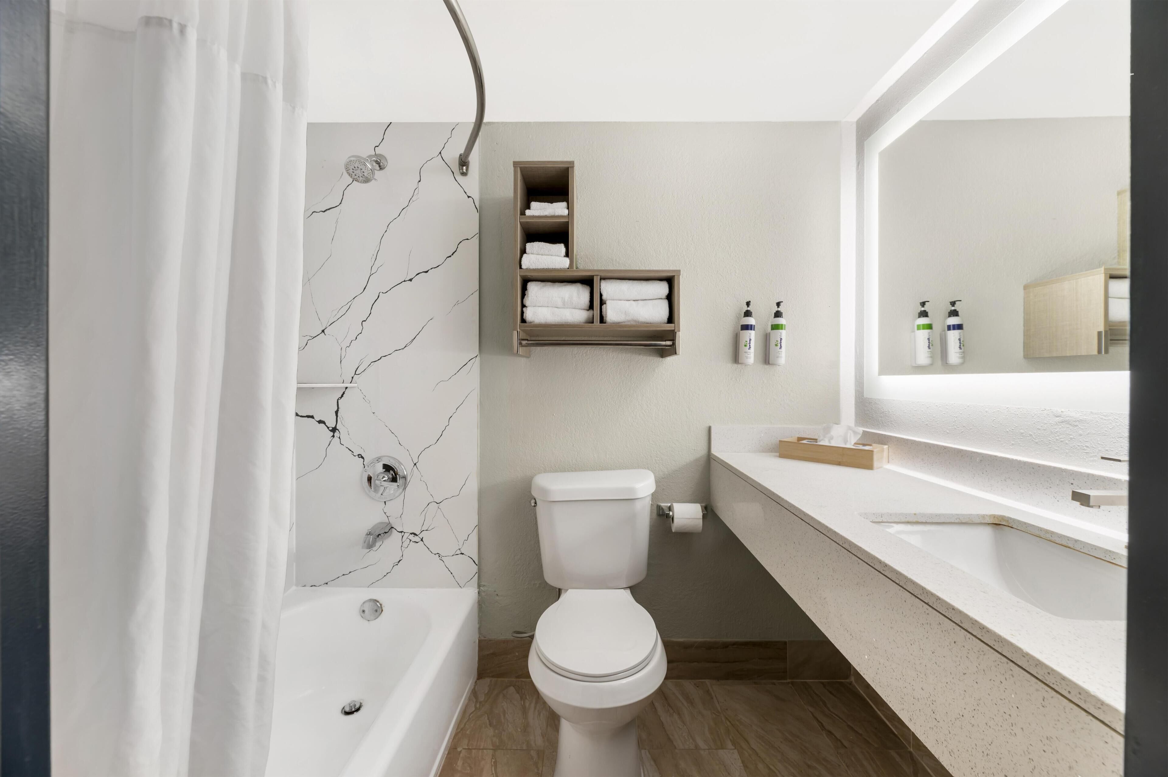 Room, 2 Queen Beds | Bathroom | Combined shower/tub, hair dryer, towels, soap