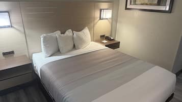 Premium bedding, desk, laptop workspace, blackout curtains