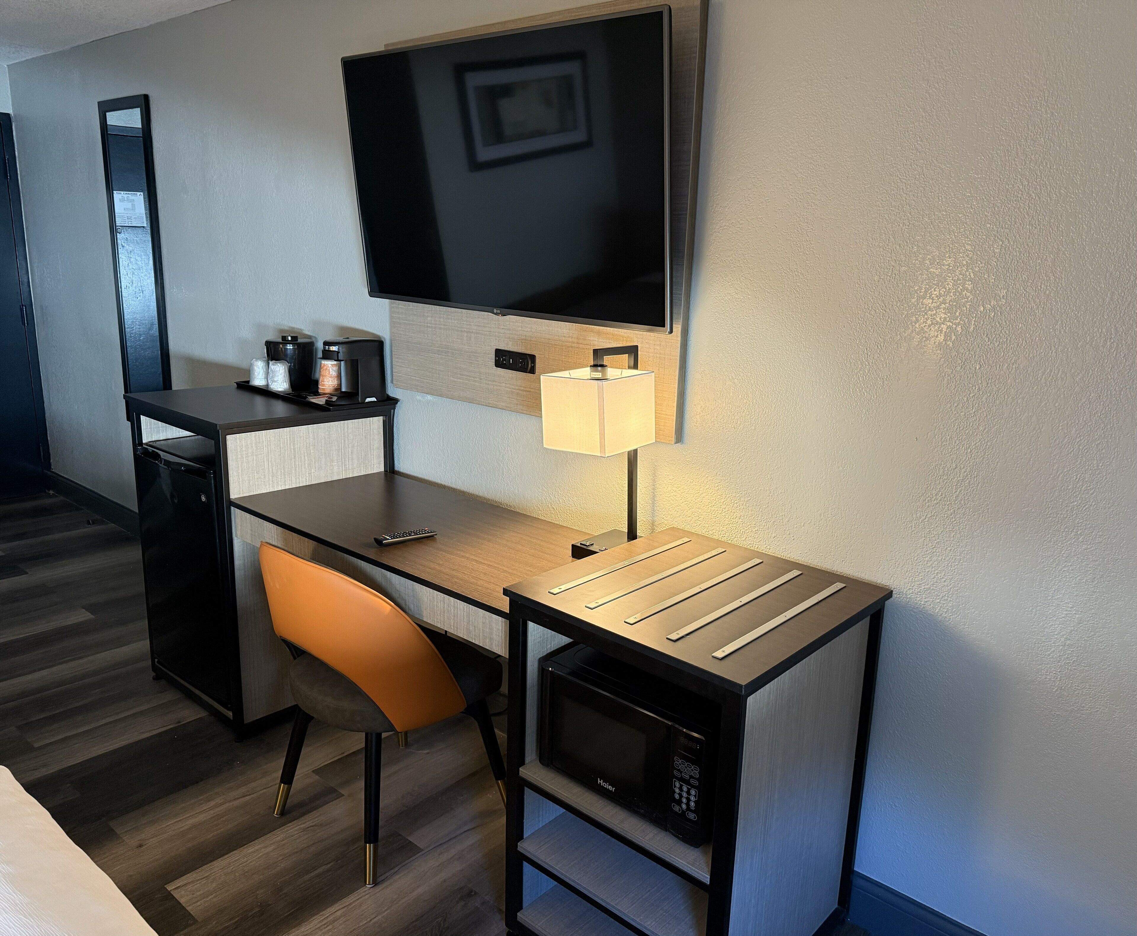 Premium bedding, desk, laptop workspace, blackout drapes