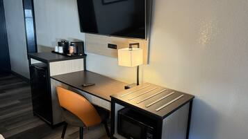 Premium bedding, desk, laptop workspace, blackout drapes