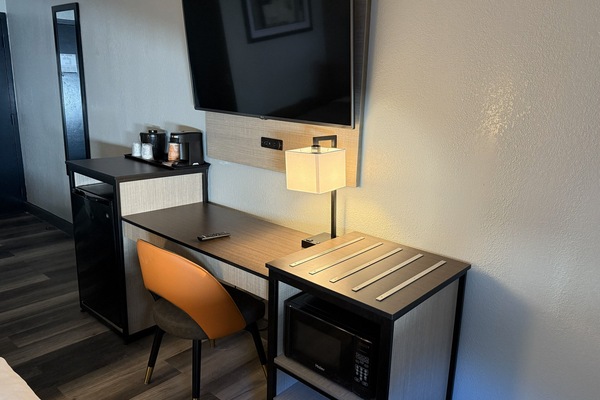 Premium bedding, desk, laptop workspace, blackout curtains