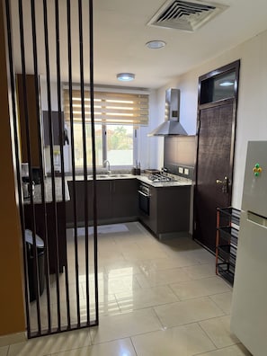 Deluxe Apartment, 1 Bedroom | Private kitchen - Lizzy Complex East Legon (Accra)