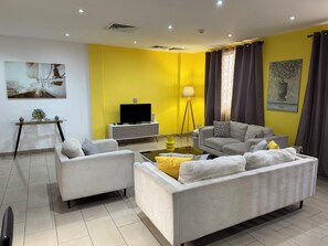 Deluxe appartement, 1 slaapkamer | Woonruimte