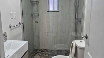 Shower, towels, soap, toilet paper