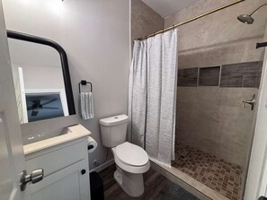 Shower, towels, toilet paper