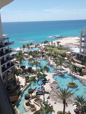 A resort with multiple swimming pools, palm trees, and a beach view. - Resort with 2 bedrooms and AC in enjoyable San Jose del Cabo after April 16 2026 (San Jose del Cabo)