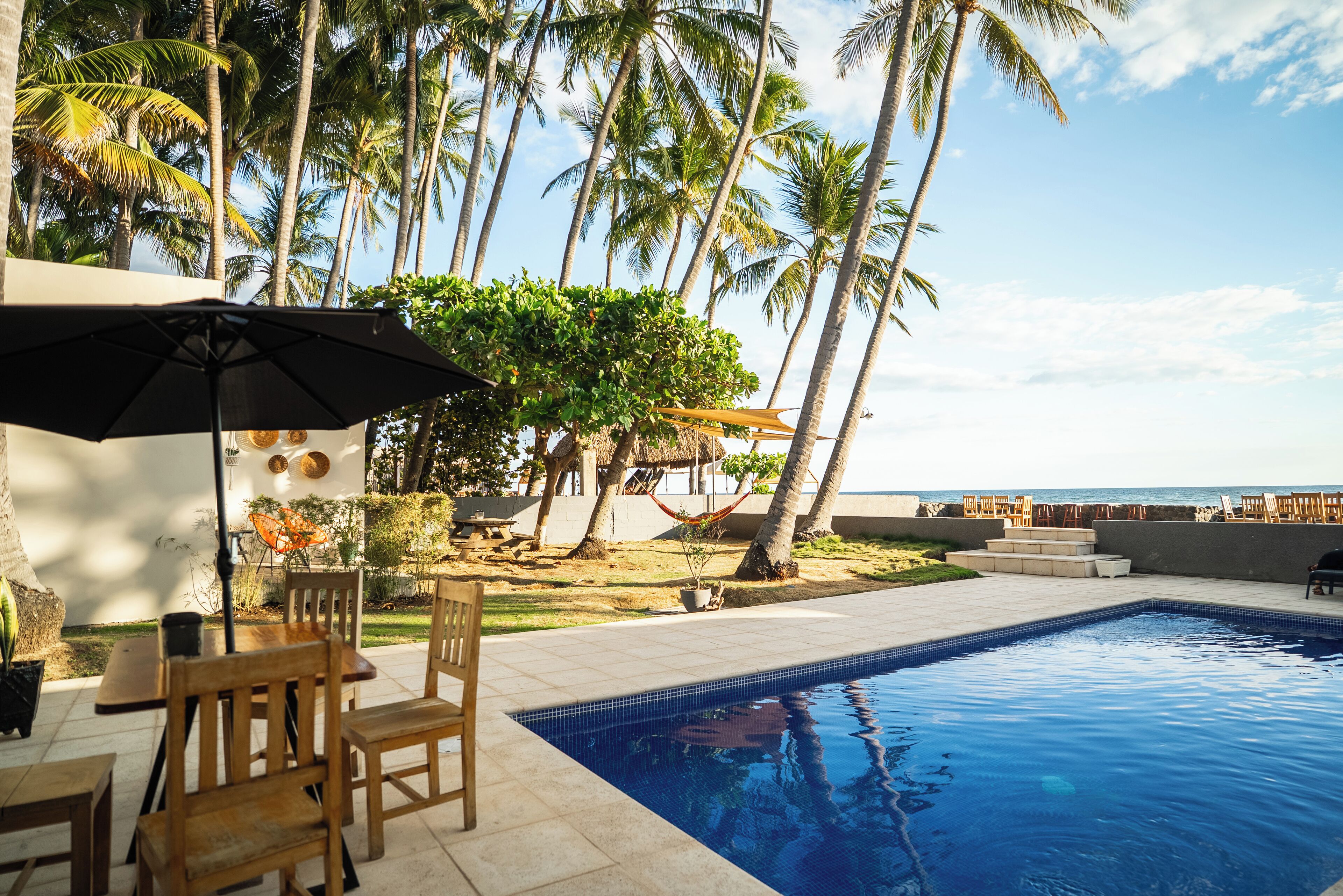 Outdoor pool, open 7:00 AM to 10:00 PM, sun loungers