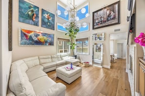 TV, fireplace - Beach Retreat- Walk to Beach! Spacious 4BR, Oceanview, BBQ & Firepit- Sleeps 12 (Huntington Beach)