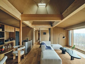 A modern interior with a kitchen, dining area, and living space. - SANU 2nd Home Niseko 1st (Niseko)