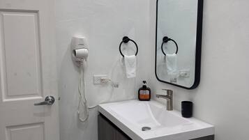 Hair dryer, towels, soap, toilet paper