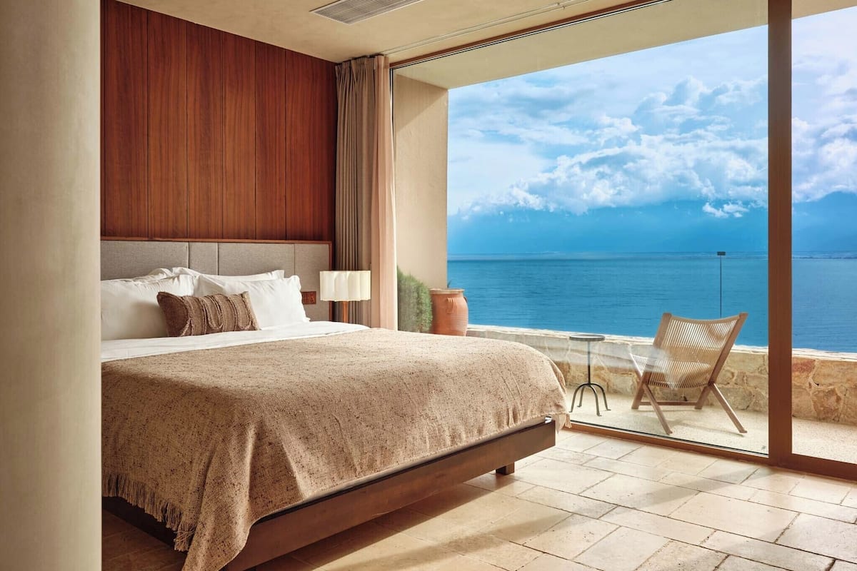 Luxury Suite, Patio, Sea View | Free minibar, desk, laptop workspace, blackout curtains