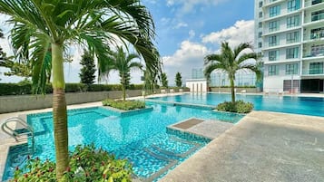 Outdoor pool, open 7:00 AM to 10:00 PM, sun loungers