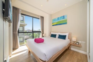 Appartement Deluxe, 2 chambres, balcon | Coffres-forts dans les chambres, rideaux occultants