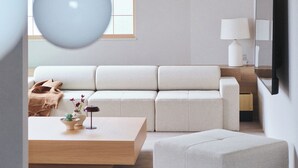 A modern living room with a sofa, ottoman, and a dining table set with food and drinks. - 2025/10Open! Lux Villa(132 m2) 6 min Shibuya/4m Ebisu (Ebisu, Shibuya-ku,)