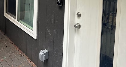 Julianna and Allan’s serene green belt view ADU with air conditioning unit.