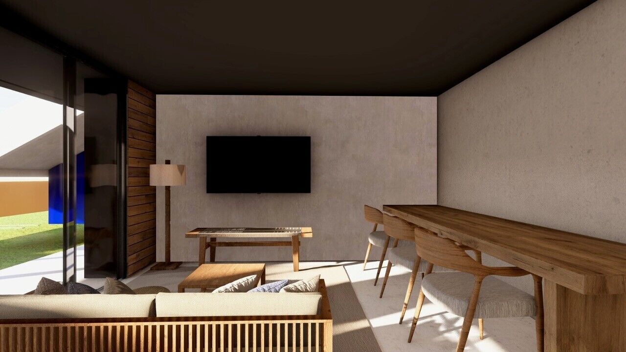 Una sala de estar moderna con una televisión de pantalla plana montada en la pared, una mesa de centro de madera, un sofá y una lámpara.