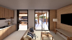 A modern living space with a kitchen, seating area, and a TV. - Kibaima Apartments (Oranjestad)