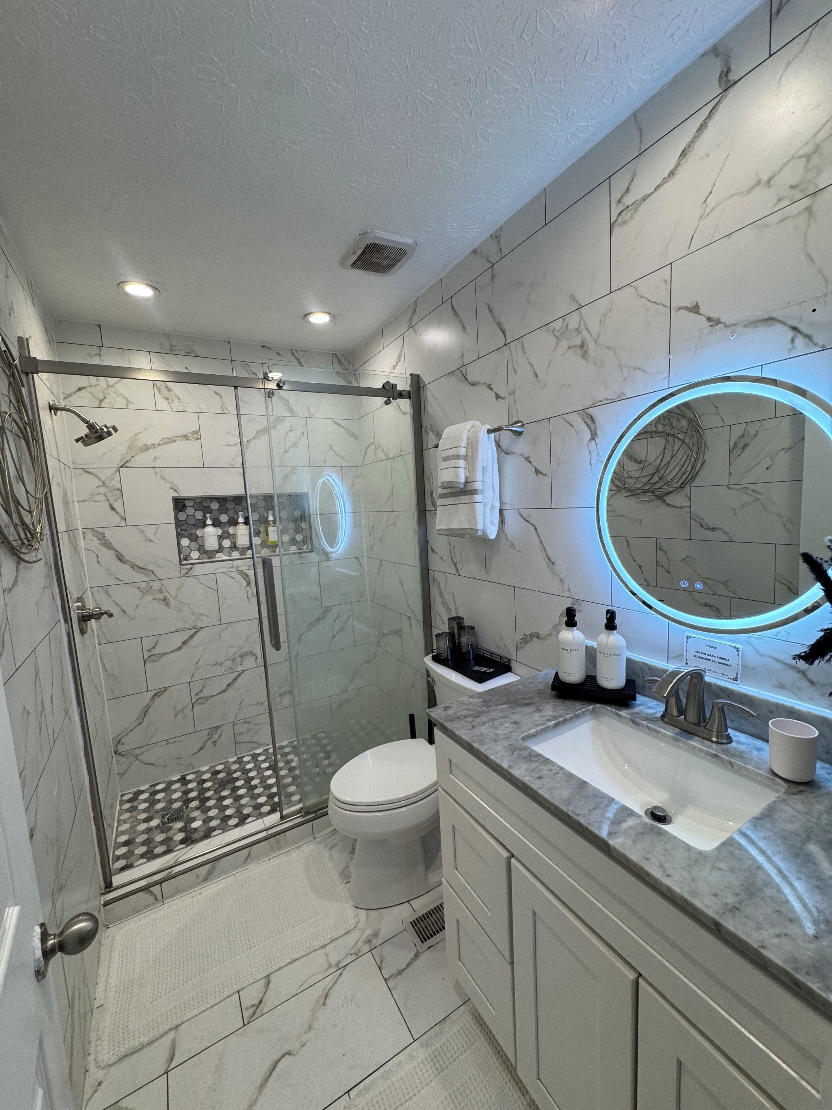 Hair dryer, towels, soap, toilet paper