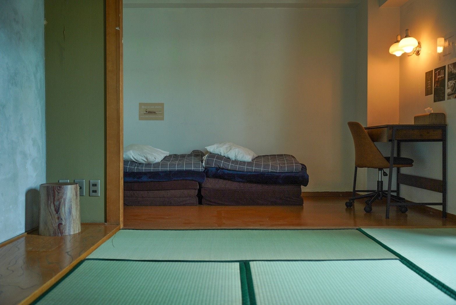 A room with a bed, a desk, and a chair.
