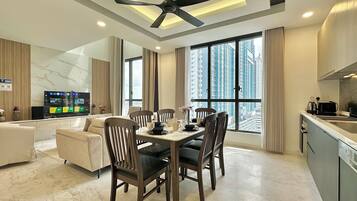 Comfort Duplex, 3 Bedrooms, City View | Living area | Flat-screen TV