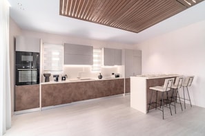 Deluxe Villa, Patio, Pool View | Private kitchen - Le Ciel Suites & Villas (Mykonos)