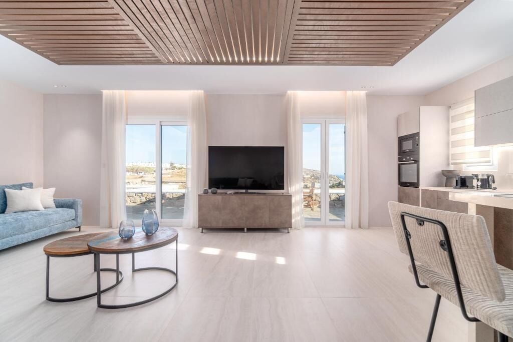 Deluxe Villa, Patio, Pool View | Living area | TV