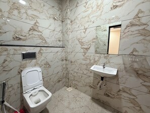 Deluxe Double Room, City View | Bathroom | Shower, slippers, towels, soap - hotel shivlok inn (Ujjain)