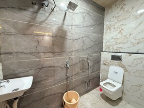 Family Studio | Bathroom | Shower, slippers, towels, soap - hotel shivlok inn (Ujjain)