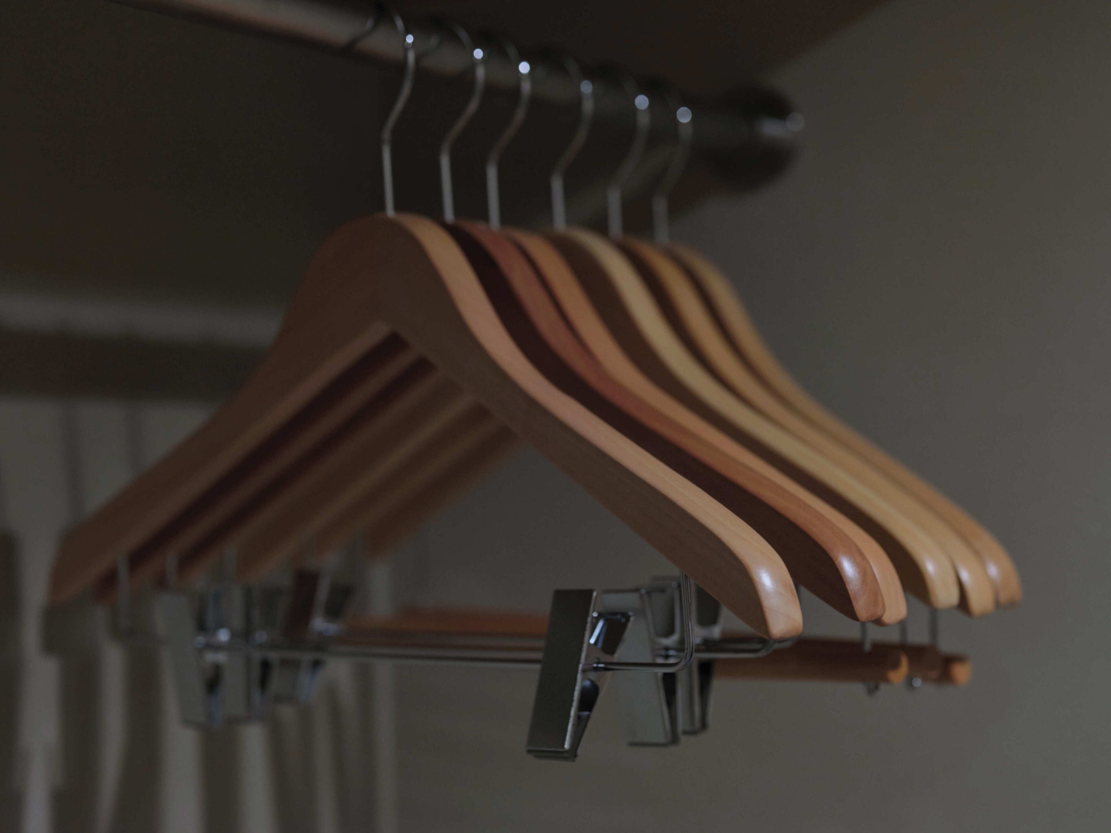 A rack of wooden hangers.