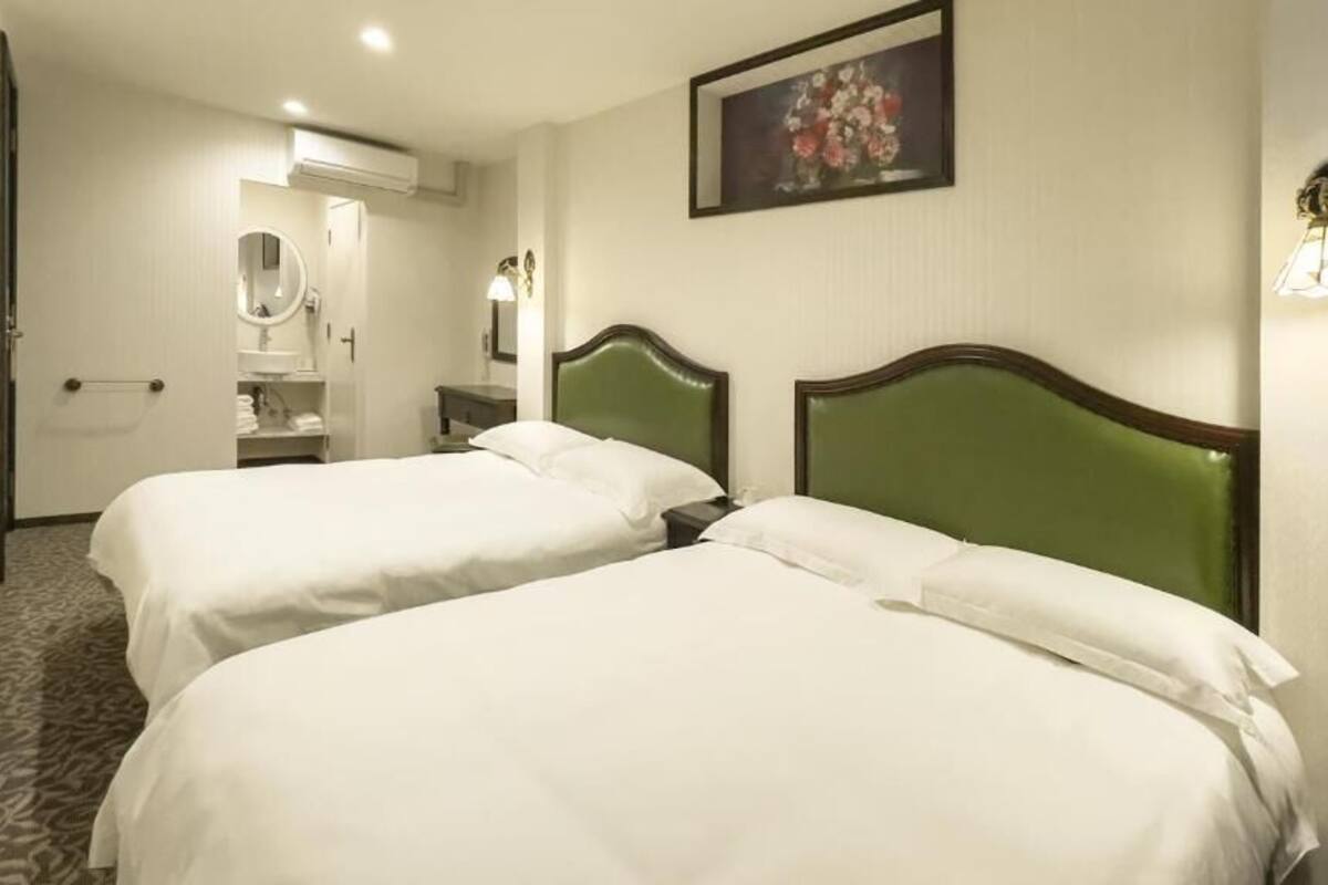 Standard Triple Room, City View | Blackout drapes, soundproofing, free WiFi