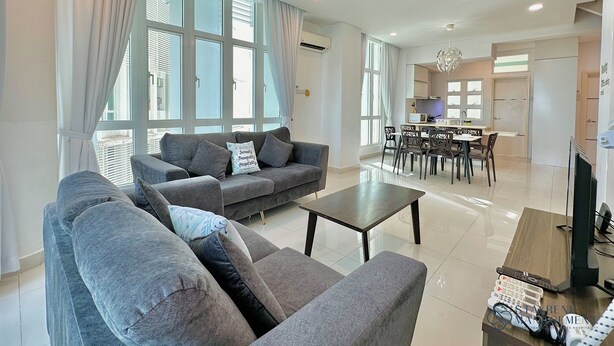 A modern living room with a sofa, coffee table, and a ceiling fan. - 1 Medini Residence Neo by Stayrene (Iskandar Puteri)