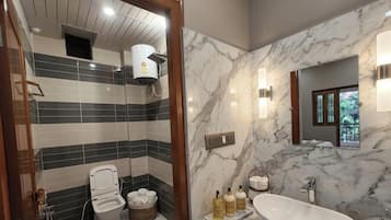 Shower, rainfall showerhead, towels, soap