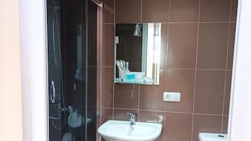 Standard Triple Room, City View | Bathroom | Shower, hair dryer, towels, soap