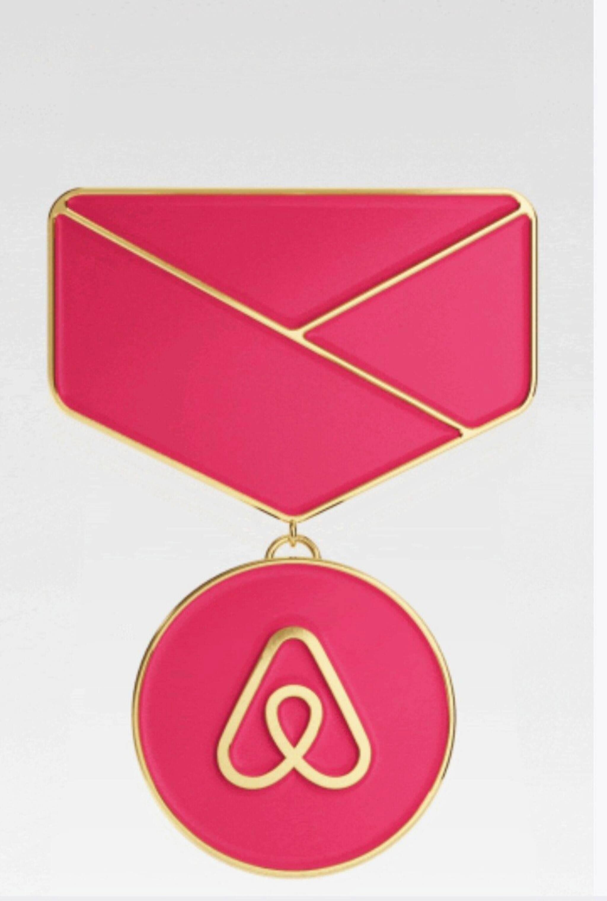 A red envelope with a gold border and a gold letter 'A' hanging from it.