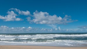 A beach with waves and a clear sky. - Monterey Dunes 208 - Moss Landing Townhome - A Mile of Beachfront! (Moss Landing)