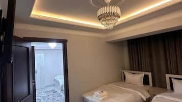 Standard Quadruple Room, City View | Blackout drapes, soundproofing, iron/ironing board (on request)