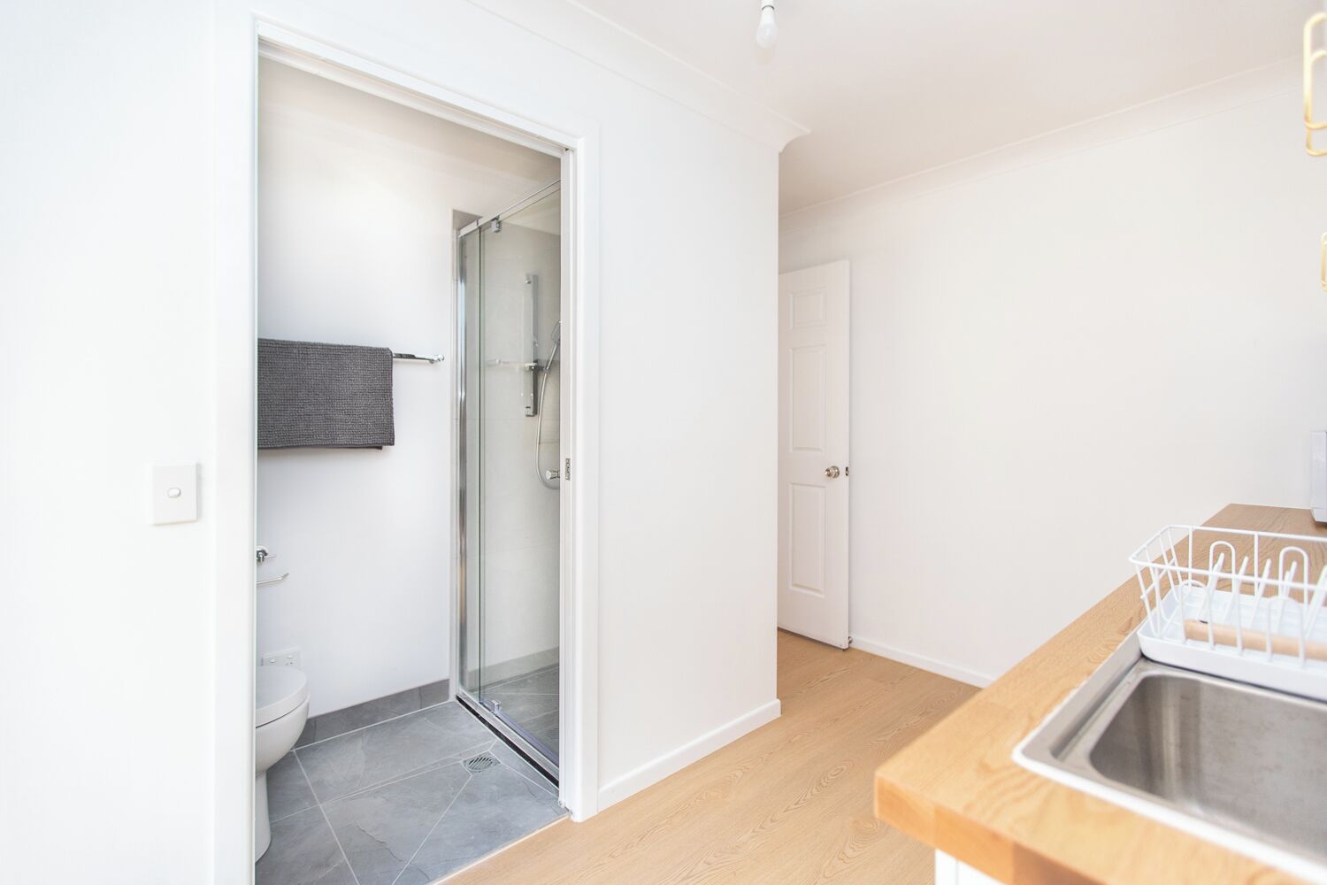 Shower, hair dryer, towels, toilet paper