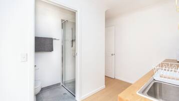 Shower, hair dryer, towels, toilet paper