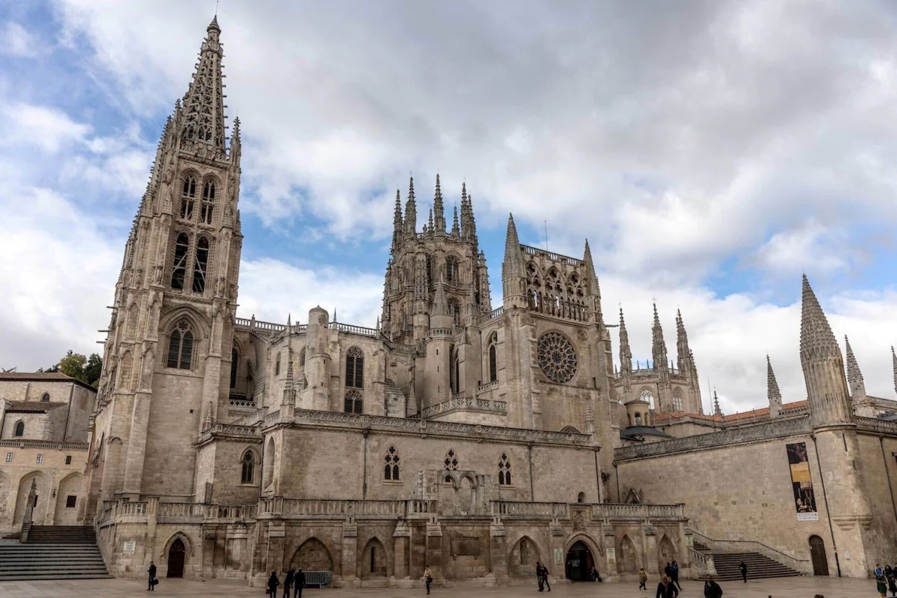 A historic cathedral with multiple spires and a large rose window.