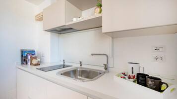 Familiesuite, byutsikt | Eget kjøkken